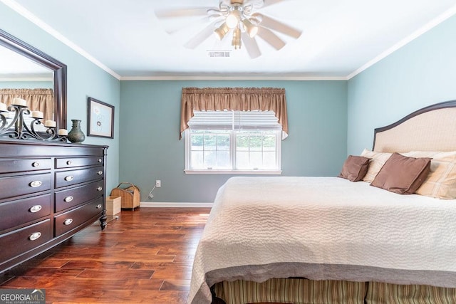 bedroom featuring ceiling fan, dark hardwood / wood-style flooring, and crown molding