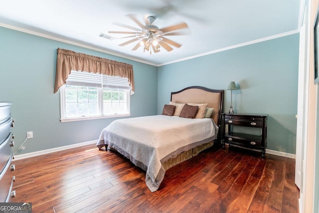 bedroom with dark wood-type flooring, ceiling fan, and crown molding