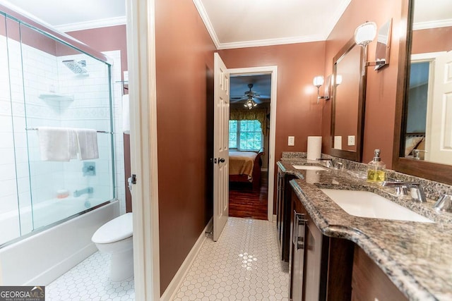 full bathroom featuring toilet, tile patterned floors, vanity, ceiling fan, and bath / shower combo with glass door