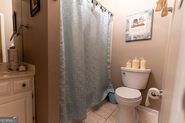 bathroom with toilet and tile patterned floors