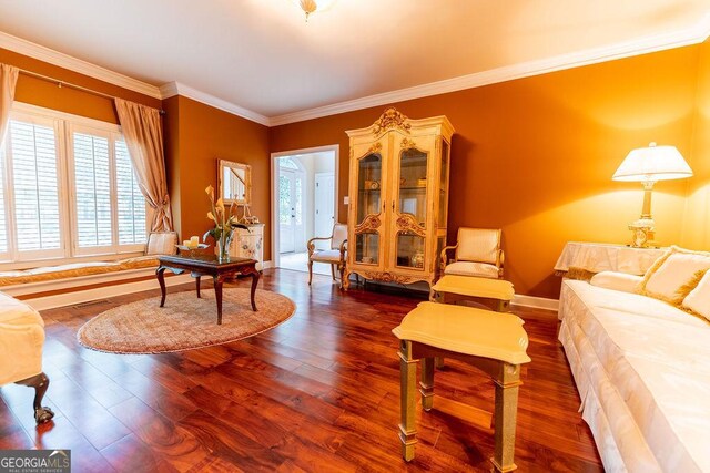 living room with ornamental molding and dark hardwood / wood-style floors