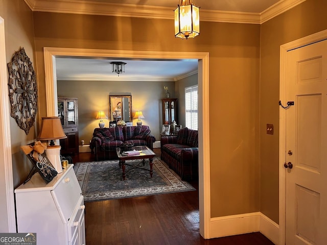 entryway featuring ornamental molding and dark hardwood / wood-style flooring