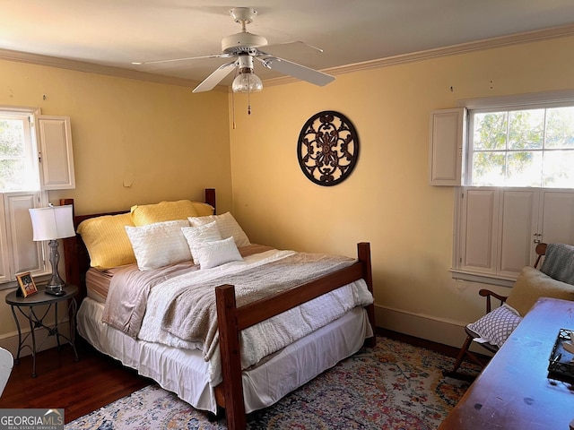 314 Cherokee Rd, Thomaston, GA 30286 - bedroom with wood finished floors, multiple windows, crown molding, baseboards, and ceiling fan