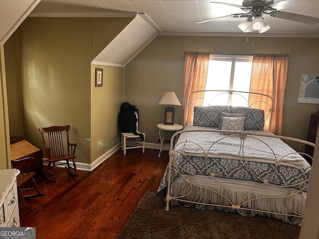 bedroom with crown molding, dark wood-type flooring, and ceiling fan