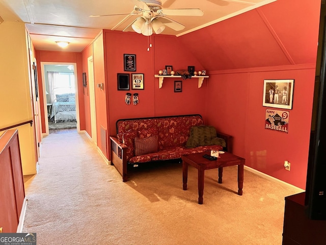 living room with vaulted ceiling, light carpet, and ceiling fan