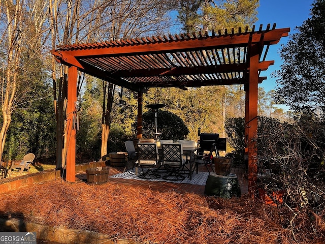 view of patio / terrace featuring area for grilling and a pergola