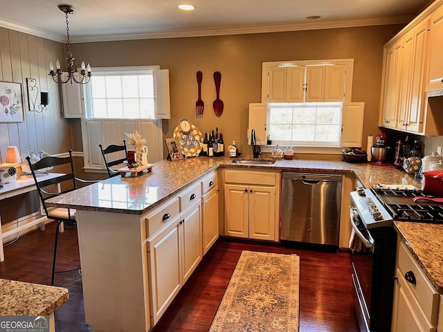 kitchen featuring pendant lighting, sink, appliances with stainless steel finishes, light stone countertops, and kitchen peninsula