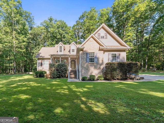 view of front property with a front yard and covered porch