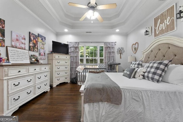 bedroom featuring ornamental molding, ceiling fan, and a raised ceiling