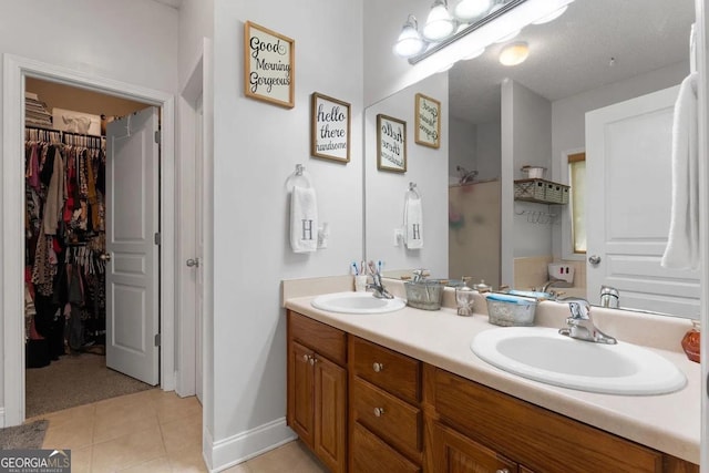 bathroom with tile patterned floors and vanity