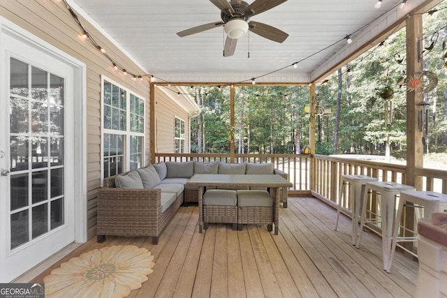 deck featuring ceiling fan and an outdoor hangout area