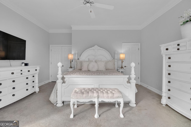 carpeted bedroom featuring ornamental molding and ceiling fan