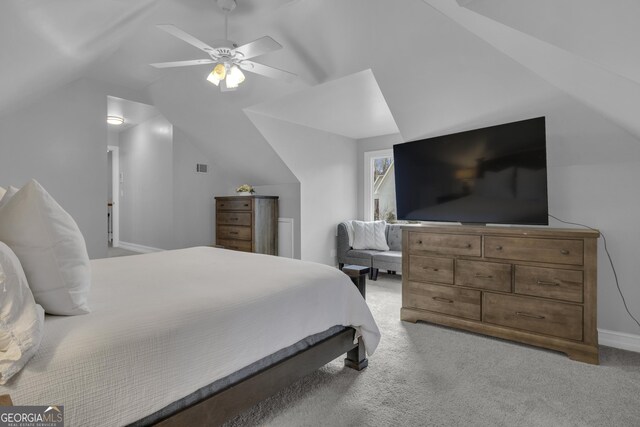 bedroom featuring lofted ceiling, carpet floors, ceiling fan, and multiple windows