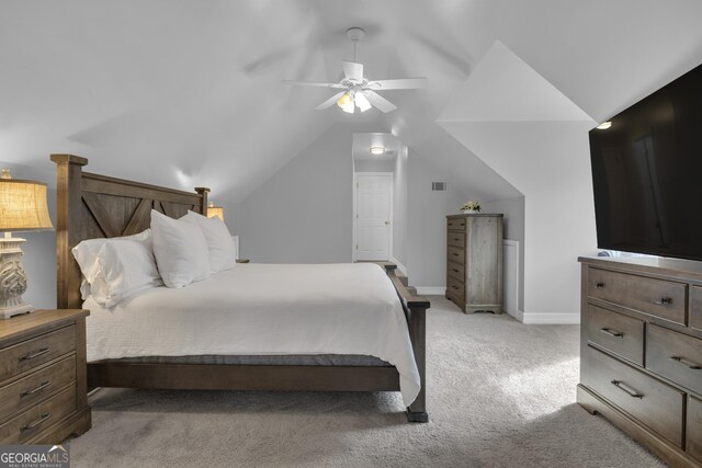 carpeted bedroom featuring lofted ceiling and ceiling fan