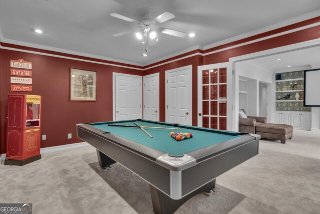 living room featuring light carpet, pool table, ceiling fan, ornamental molding, and built in features