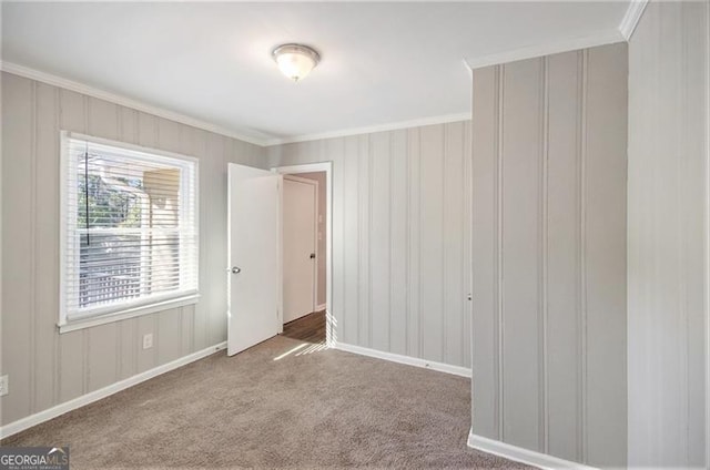 carpeted empty room with ornamental molding