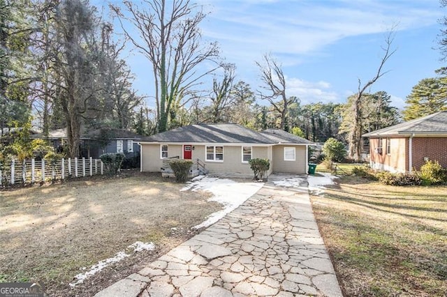 single story home with a front lawn