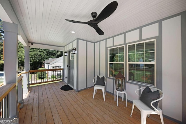 wooden deck with ceiling fan and a porch