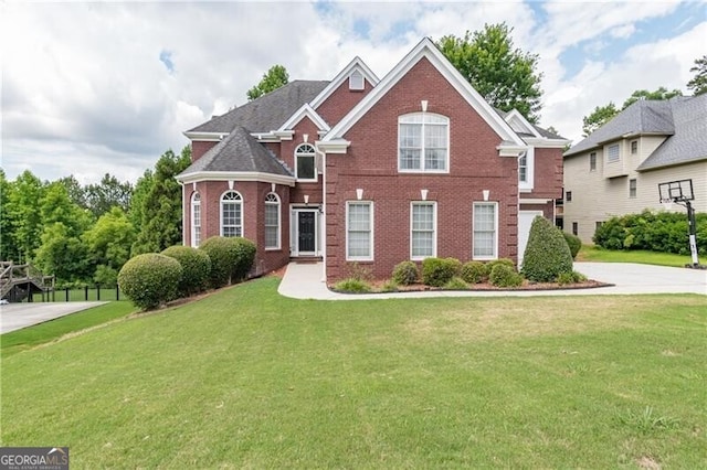 2080 Misty Oaks Dr, Buford, GA 30519 - view of front of property with brick siding, a front yard, and driveway