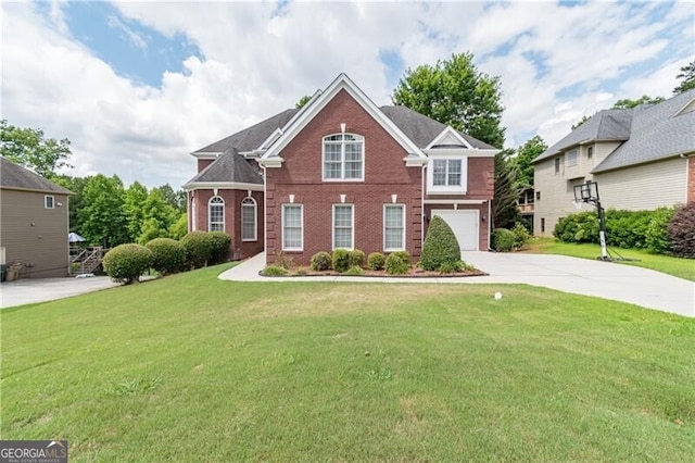 2080 Misty Oaks Dr, Buford, GA 30519 - view of front of home with brick siding, driveway, an attached garage, and a front yard