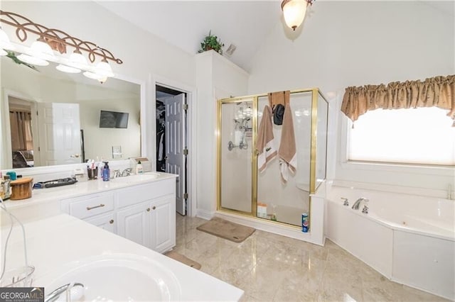 2080 Misty Oaks Dr, Buford, GA 30519 - bathroom with vanity, a garden tub, a stall shower, vaulted ceiling, and marble finish flooring