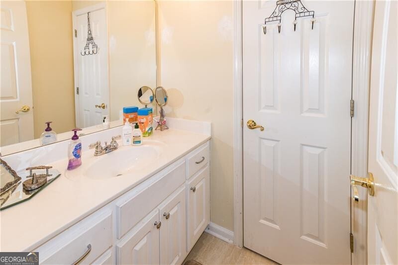 bathroom featuring tile patterned floors and vanity