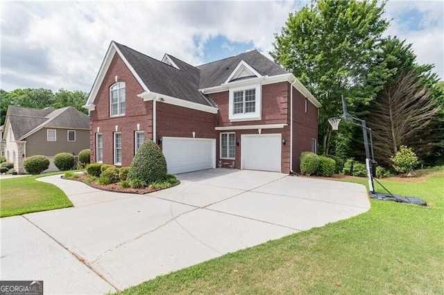 view of front of house with a front yard and a garage