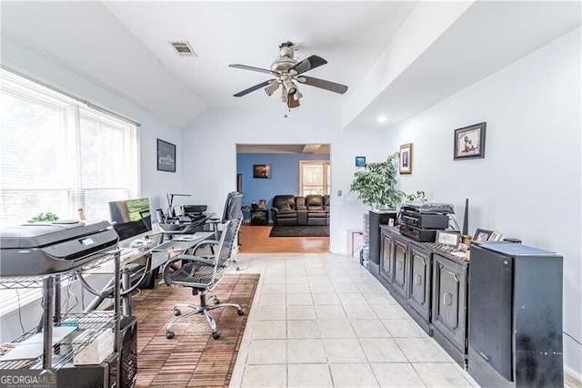 tiled office space featuring lofted ceiling and ceiling fan