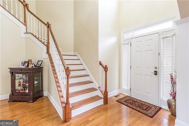 2080 Misty Oaks Dr, Buford, GA 30519 - entryway featuring stairway, light wood finished floors, and baseboards