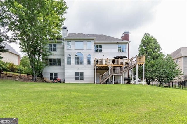 2080 Misty Oaks Dr, Buford, GA 30519 - rear view of house with a chimney, stairway, and a wooden deck