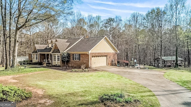 view of front of property with a garage and a front yard