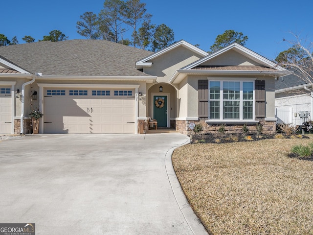 single story home featuring stone siding, stucco siding, driveway, and a garage