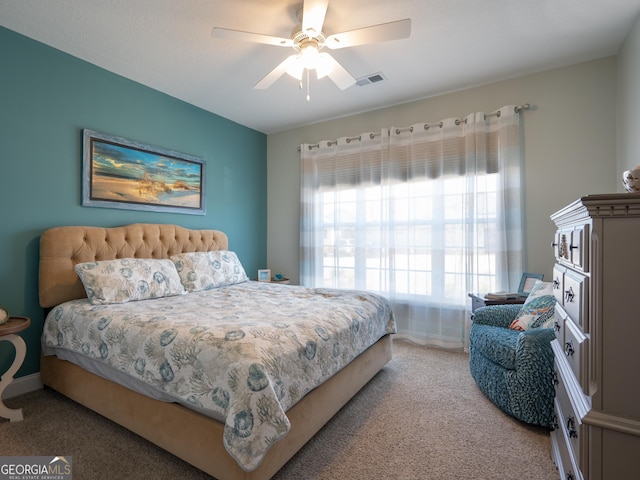 131 Ryan Nicholas Dr, Kingsland, GA 31548 - bedroom with carpet floors, baseboards, ceiling fan, and visible vents