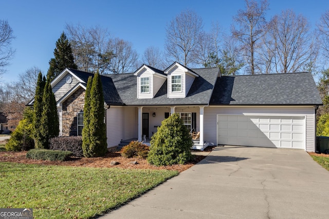 cape cod house featuring a front yard, a garage, and covered porch