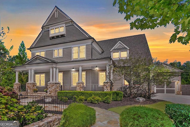 view of front of house with a garage and covered porch