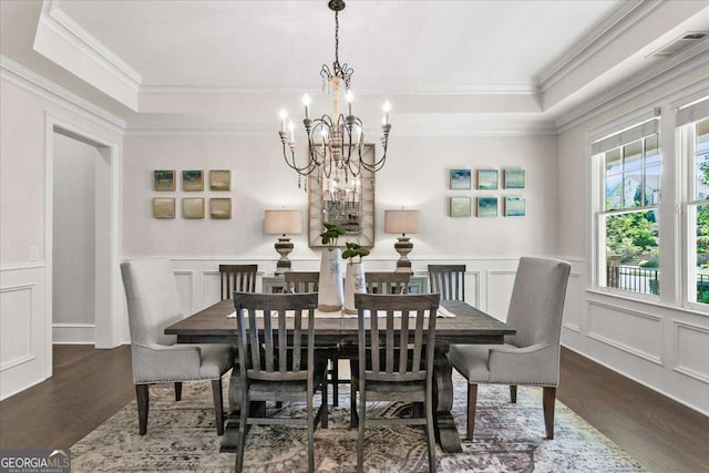 dining room with a notable chandelier and dark wood-type flooring