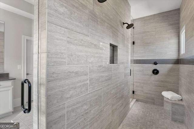 bathroom with walk in shower and vanity