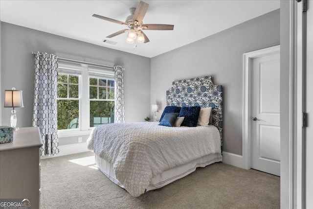 carpeted bedroom with ceiling fan