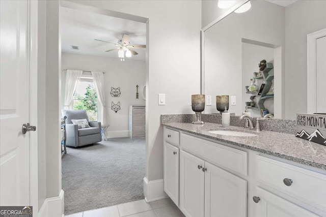 bathroom featuring ceiling fan, tile patterned flooring, and vanity