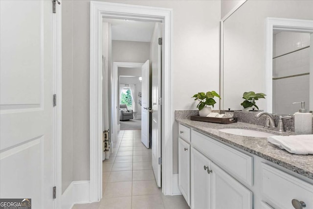 bathroom with tile patterned flooring and vanity