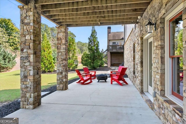 view of patio / terrace featuring a fire pit