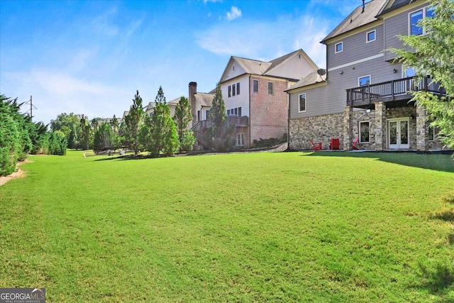 view of yard with french doors