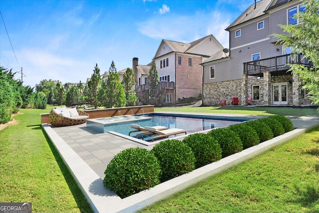 view of swimming pool featuring french doors, an in ground hot tub, a patio, and a yard