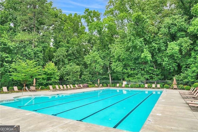 view of swimming pool featuring a patio area