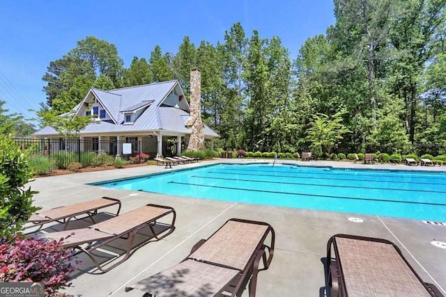 view of swimming pool with a patio area