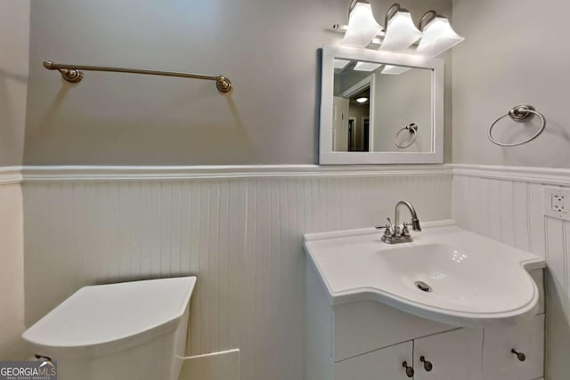 bathroom featuring toilet and vanity