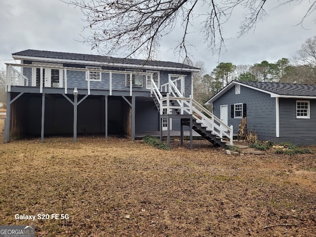 back of property with a wooden deck