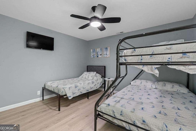 bedroom featuring ceiling fan and light wood-type flooring