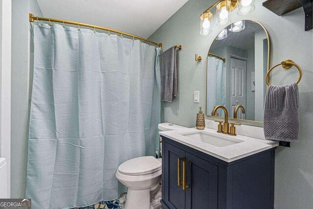 bathroom with vanity and toilet