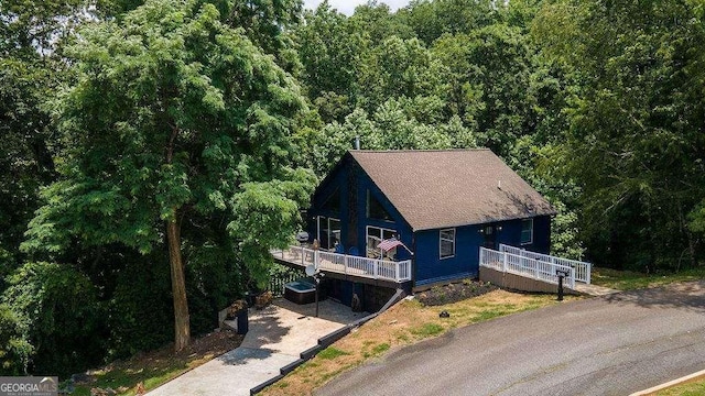 view of front of house featuring a wooden deck